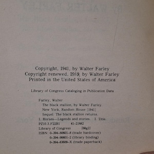 May include: A page from a book with text. The text includes copyright information from 1941 and 1969 by Walter Farley, and details about "The black stallion" book, including ISBN numbers and Library of Congress data.