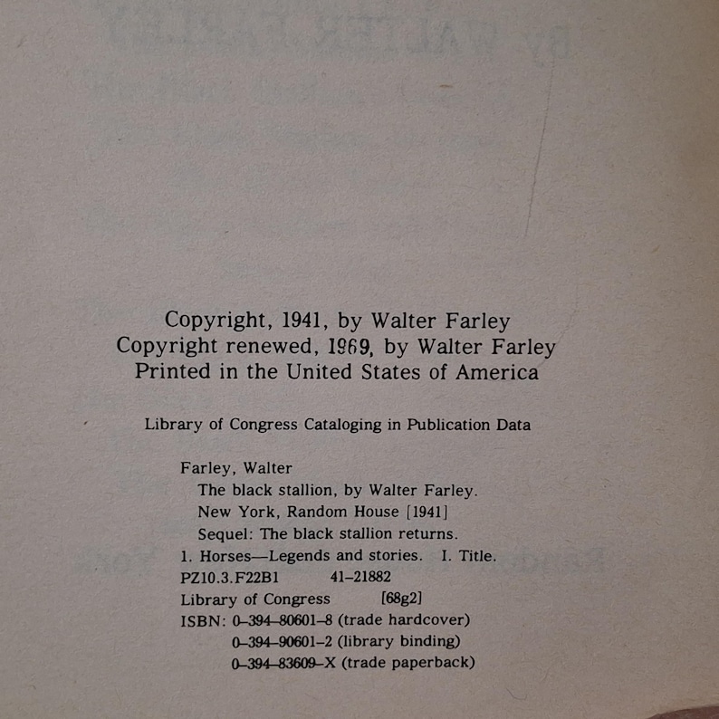May include: A page from a book with text. The text includes copyright information from 1941 and 1969 by Walter Farley, and details about "The black stallion" book, including ISBN numbers and Library of Congress data.