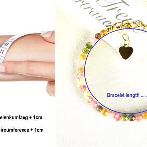 May include: A colorful beaded bracelet with a gold heart charm. The bracelet is shown on a white surface with the text "Bracelet length ..... cm".