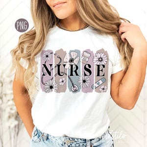 May include: White t-shirt with a floral design and the word "NURSE" printed on it. The design includes a stethoscope, a bandage, and a pill bottle.