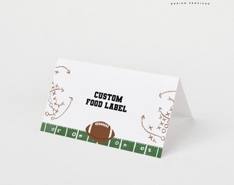 May include: White card with a brown football on a green field with yard lines. The text "CUSTOM FOOD LABEL" is in black bold font. There are brown and white markings on the card that look like football plays.