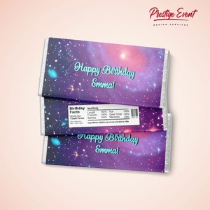 May include: Three chocolate bars with a galaxy-themed wrapper. The wrappers feature the text "Happy Birthday Emma!" in a teal script font. One wrapper includes a "Birthday Facts" label. The background is a mix of purple, pink, and blue.