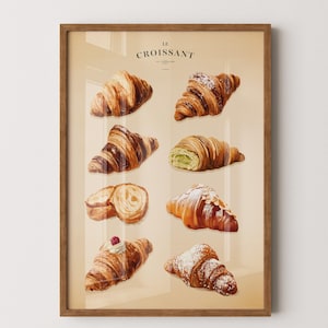 Könnte beinhalten: Ein gerahmter Druck mit einer Sammlung von Croissants. Das Bild zeigt verschiedene Arten von Croissants, darunter einfache, Mandel- und gefüllte Varianten. Der Text "LE CROISSANT" ist oben zu sehen. Das Kunstwerk ist vor einem beigefarbenen Hintergrund platziert.