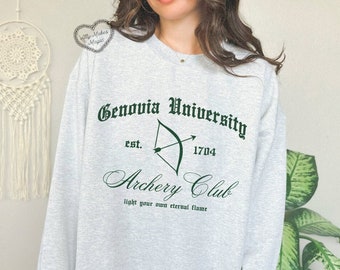 May include: Gray sweatshirt with a green print that says "Genovia University est. 1704 Archery Club light your own eternal flame"
