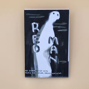 May include: A black and white book cover with the word "RED MAN" written in large, stylized letters. The cover also features a white, ghost-like figure with two eyes. The text below the title reads "MY EXPERIENCES WITH AUDIO AND VISUAL HALLUCINATIONS."