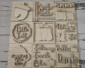May include: Nine wooden signs with autumn-themed sayings and images. The signs include "Hello Fall", "Sweater Weather", "Fall is my favourite colour", "Pumpkin Spice Latte", "Nuts about Autumn", and "Hello Pumpkin".