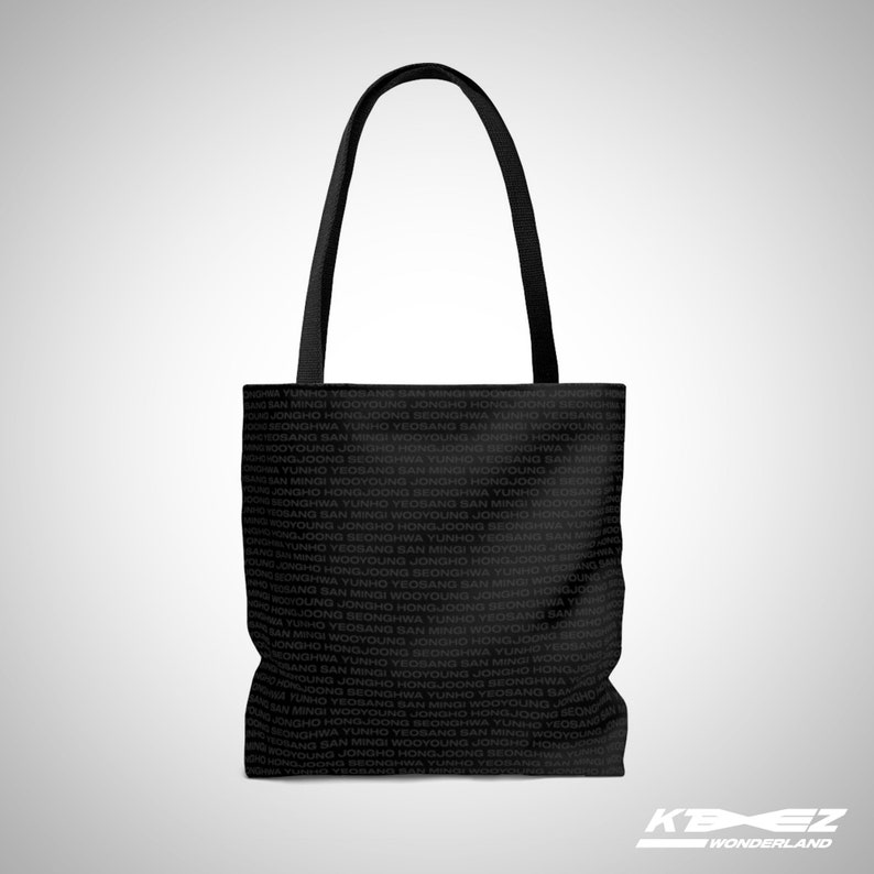 May include: Black tote bag with a repeating pattern of Korean names. The bag has two black handles.