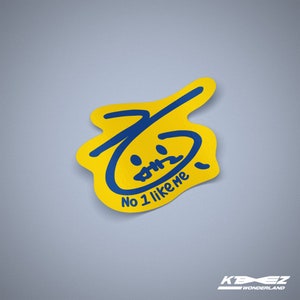 May include: Yellow sticker with a blue hand-drawn face and the text "No 1 like me".
