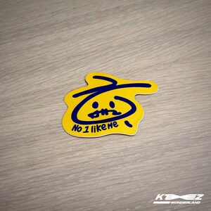 May include: Yellow sticker with a blue cartoon face and the text "No 1 like me".
