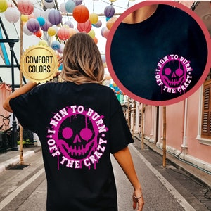 May include: Black t-shirt with a pink skull graphic and the text "I run to burn off the crazy".