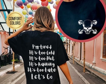 Może przedstawiać: Czarny T-shirt z białym tekstem, który brzmi: "Jestem zmęczony, Jest za zimno, Jest za gorąco, Pada deszcz, Jest za późno, Chodźmy".