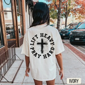 Lift Heavy Pray Hard Ivory Shirt, Comfort Colors, Gym Pump Cover, Christian Shirt, Weightlifting Shirt, Christian Gym Shirt, Jesus Lover Shirt, Woman of God, Oversized Gym Shirt