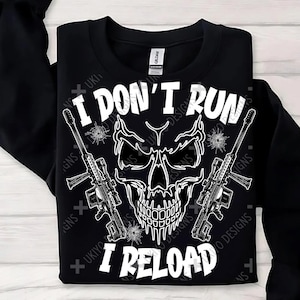 May include: Black sweatshirt with a white skull and crossbones graphic. The text "I don't run I reload" is printed below the skull.