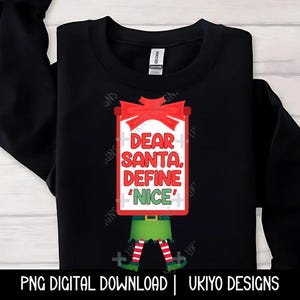 Puede incluir: Sudadera negra con un gráfico de un elfo navideño rojo y verde. El elfo sostiene un cartel que dice "Querido Santa, Define 'Nice'".