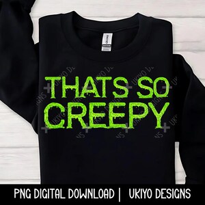 May include: Black sweatshirt with green dripping text that reads "That's So Creepy".