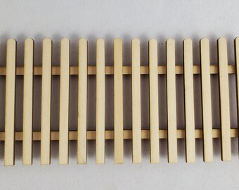 May include: A wooden picket fence with 18 vertical slats, ideal for miniature dollhouse or model train layouts.