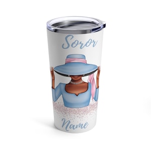 May include: A white stainless steel tumbler with a blue and pink illustration of a woman wearing a hat. The text "Soror" and "Name" are printed on the tumbler.