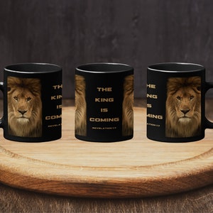 May include: Three black coffee mugs with a lion image and the text "The King is Coming Revelation 17" printed in gold.