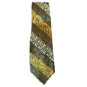 May include: A vintage necktie with a diagonal striped pattern. The tie features alternating stripes of brown, gold, and white. The gold stripes have a textured design. The tie is made of a woven fabric.