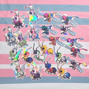 May include: A collection of 20 iridescent holographic stickers featuring various insect designs. The insects are depicted in a variety of colors, including pink, blue, green, yellow, and red. The stickers are perfect for adding a touch of whimsy to laptops, water bottles, journals, and other surfaces.