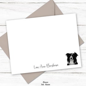 May include: A white card with a black and white border collie dog illustration. The card has the text "Lou Ann Basham" written in black ink.