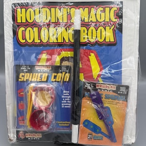May include: A packaged kids' magic bundle featuring a coloring book, a magic wand, and several magic tricks. The packaging includes the text "Houdini's Magic Coloring Book" and "Spiked Coin". The bundle is wrapped in clear plastic.