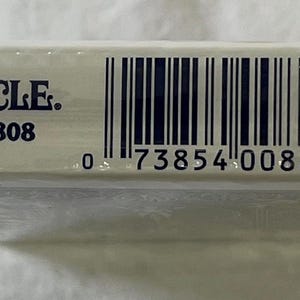 May include: A sealed deck of Bicycle Poker 808 playing cards. The white box features the brand name and product information in blue text, along with a barcode. The deck is wrapped in clear plastic.
