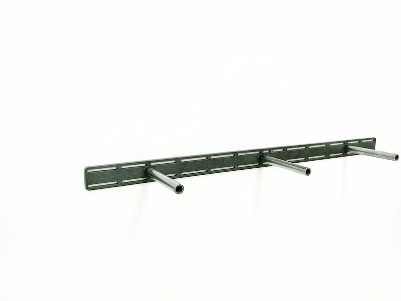 May include: A metal shelf bracket with three adjustable arms. The bracket is designed for mounting shelves to a wall.