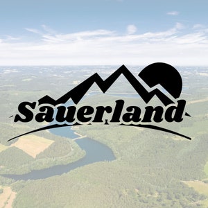 May include: Black and white logo with the word "Sauerland" in a bold, stylized font. The logo features a mountain range with a sun rising behind it.