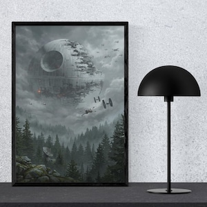 May include: A framed Star Wars art print depicting the Death Star above a forest with X-wing fighters. The artwork is in shades of grey and black, with a black frame. A black desk lamp with a dome-shaped shade is next to the framed print.