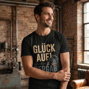 Maglietta portafortuna da uomo | Maglietta in cotone biologico della Ruhr | Regalo da minatore da uomo | Abbigliamento da minatore NRW, amore per la casa | Look vintage nero