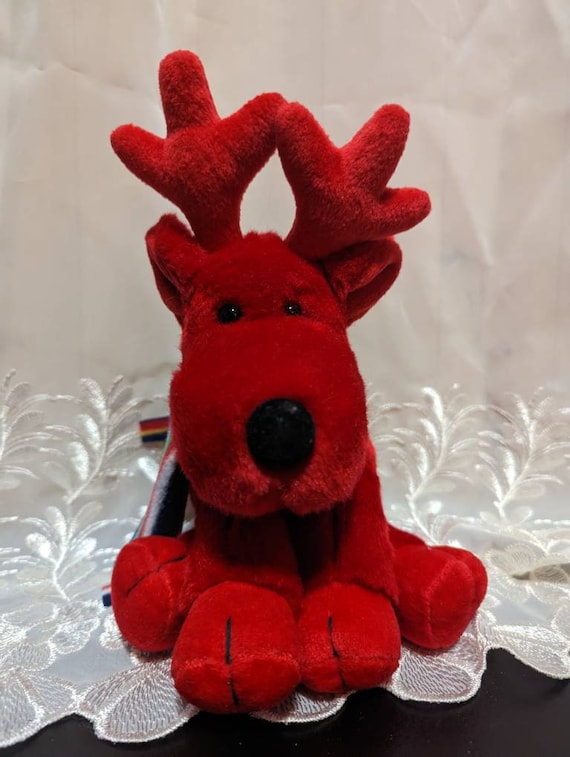 ラス・ベリー - カラフルなスカーフをまとった赤いトナカイ「GROG