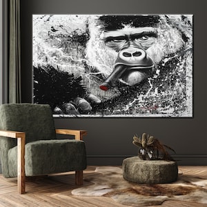 May include: Large black and white canvas art featuring a gorilla smoking a cigar. The gorilla's face is detailed with expressive eyes and a serious expression. The artwork has a modern, abstract style with paint splatters.