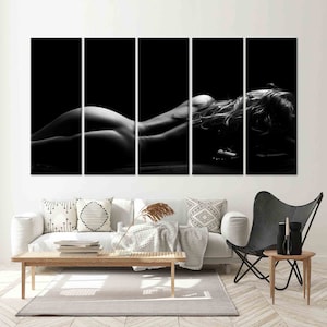 May include: Black and white photo of a person lying on their stomach with their hair spread out. The photo is split into five sections.