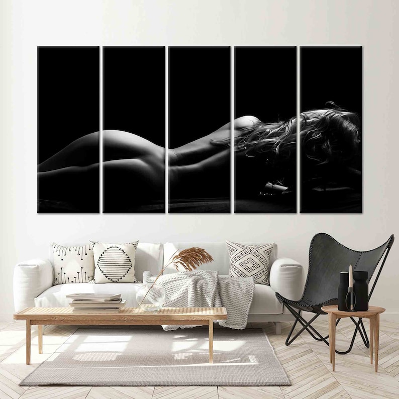 May include: Black and white photo of a person lying on their stomach with their hair spread out. The photo is split into five sections.