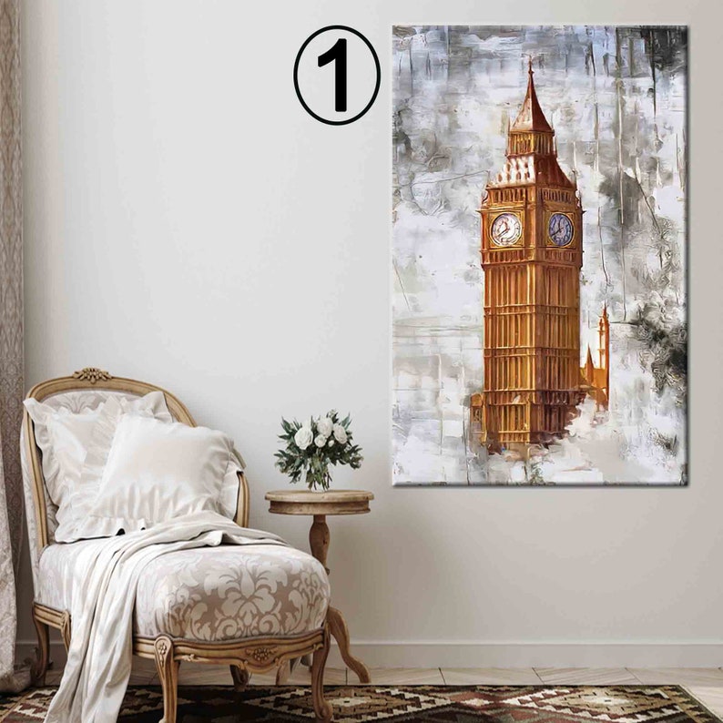 May include: An abstract painting of the Elizabeth Tower, also known as Big Ben, in London. The artwork features a gold-colored tower with clock faces, set against a textured, neutral-toned background. The painting is displayed in a room with a decorative chair and side table.