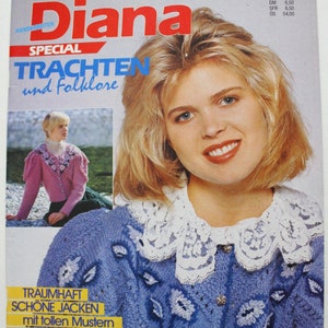 May include: Magazine cover of "Diana" with the headline "Trachten und Folklore." The cover features a smiling blonde woman wearing a blue knitted jacket with white floral embroidery and a lace collar. A smaller image shows a woman in a pink sweater.