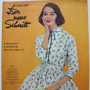 May include: A vintage 1958 fashion magazine cover titled Schwabe Der neue Schnitt Grosses Sommer-Modenheft. The cover features an illustration of a person wearing a white dress with a green and blue leaf pattern, a green collar tie, and a belt.