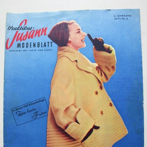 May include: A vintage magazine cover featuring a woman wearing a light brown coat with a white collar and a dark brown hat. The magazine is called "Praktikus-Jusann MODENBLATT" and the text "Alle Modelle auf zwei Schnittbogen EINZELHEFT DM 1.50 IM ABONNEMENT DM 1.25 zuzüglich Zustellgebühr Erscheint monatlich Verlagsort Nürnberg MODE WÄSCHE HANDARBEIT" is printed on the bottom.