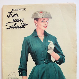 May include: A vintage magazine cover featuring a woman wearing a green dress and a gray hat. The magazine is titled "Der neue Schnitt" and is from 1958.