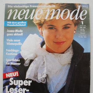 May include: A magazine cover featuring a woman wearing a white lace collar and a blue denim jacket. The magazine is titled "neue mode" and has the text "Super Leser Service" in red and white. The text "Unser Angebot: Viele Schnitte IN IHRER GRÖSSE zu bestellen" is at the bottom of the cover.