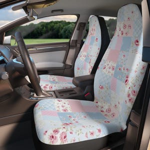 May include: A pair of car seat covers with a patchwork design featuring pink, blue, and white floral patterns. The covers are made of a soft, comfortable fabric and are designed to protect your car seats from dirt and wear.