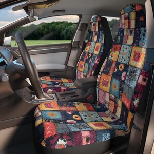 May include: Car seat covers with a patchwork design in various colors, including blue, orange, and yellow. The covers feature a mix of geometric and floral patterns, creating a vibrant and unique look. The seats are installed in a car interior.