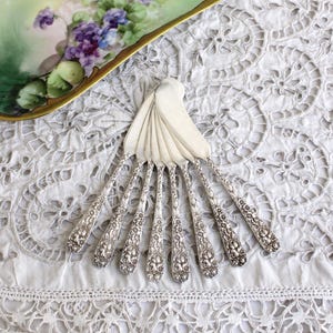Stieff Rose Floral Repousse Sterling Silver butter spreaders Sold Individually