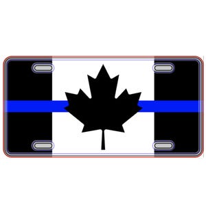 May include: A black and white Canadian flag with a blue thin line across the middle. The flag is on a license plate.
