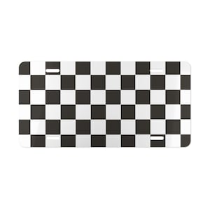 May include: Black and white checkered pattern license plate. The plate has two holes on the top and two holes on the bottom.