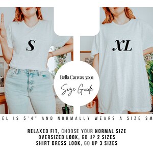 May include: A size guide for Bella Canvas 3001 t-shirts. The model is wearing a size small and a size extra large t-shirt. Relaxed fit, choose your normal size. Oversized look, go up 2 sizes. Shirt dress look, go up 3 sizes.