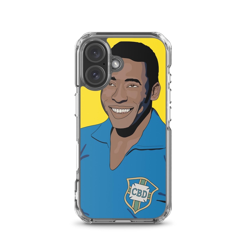 May include: Clear phone case featuring a vibrant illustration of Pel&eacute; with a yellow background. The portrait shows Pel&eacute; in a blue jersey with a shield emblem. The case is designed to protect the phone while showcasing the artwork.