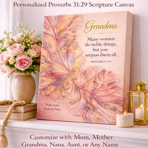 May include: A personalized canvas print with the word "Grandma" and a floral design. The canvas features a Bible verse and is displayed with flowers, candles, and a lantern. Text reads "A Meaningful Gift for Every Mother Figure."