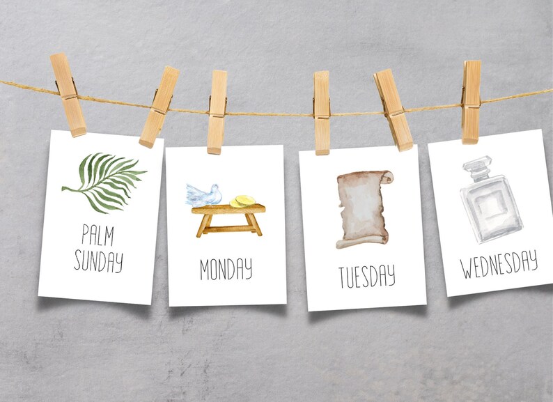 May include: Four white cards with watercolor illustrations and text hanging on a clothesline with wooden clothespins. The cards depict Palm Sunday, Monday, Tuesday, and Wednesday of Holy Week.